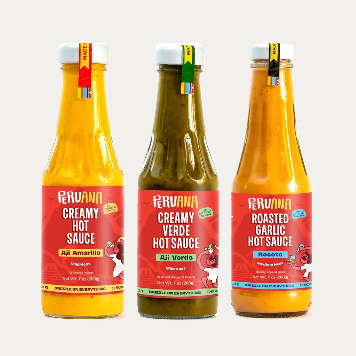 Three bottles of Peruana Peruvian hot sauce